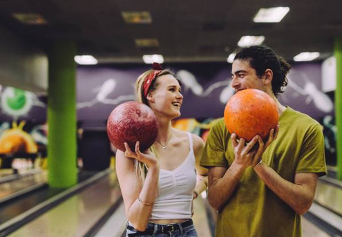 Date Night Delight - Indulge in a Gourmet Pizza, Loaded Fries, Two Slushies, Bowling, Golf Simulator & 30-Minutes of Arcade Fun for Two People - Option for Four People