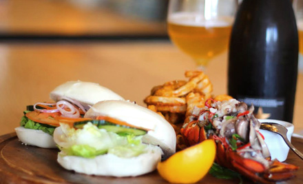 $49 for Two Chargrilled Lobster Burgers Served with an Italian Five Cheese Mornay, Curly Fries and a 750ml Bottle of Estrella Damm Inedit for Two People (value $74)
