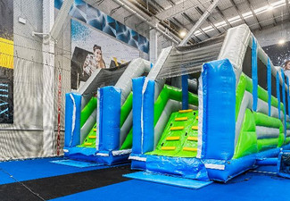 One-Hour Entry to Friday Fun at Inflatable World Incl. One Natural Fruit Slushie - Valid Fridays Only