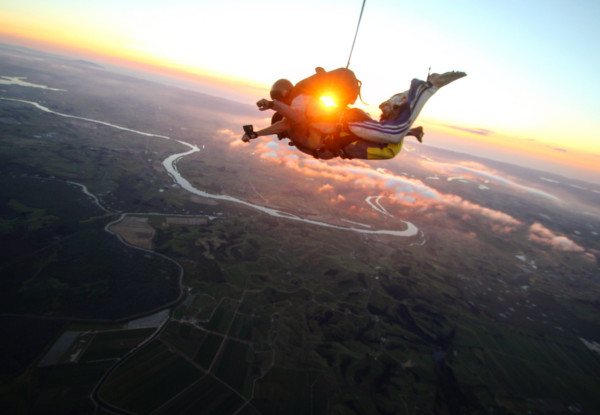 13,000-Feet Tandem Skydive Package with Views of NZ's Biggest City & Beyond incl. $20 Voucher Towards Photo or Video or Combo - Options for 9,000 & 7,500 Feet & Two People