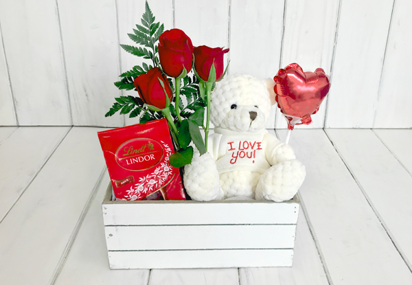 Valentine's Day Variety Gift Package incl. Three Roses, Lindt Chocolates, a Red Heart Balloon & Teddy Bear Delivered in a White Basket incl. Free Auckland Delivery