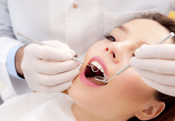 $59 for a Dental Scale, Clean & Polish for One Person or $110 for Two People with Free Full Mouth Exam