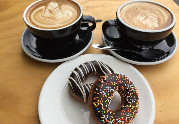 Two Medium Hot Beverages with Two Iced Cake Donuts at The Naked Baker